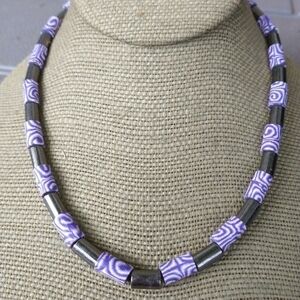 Women's marked fish purple tie dye necklace.